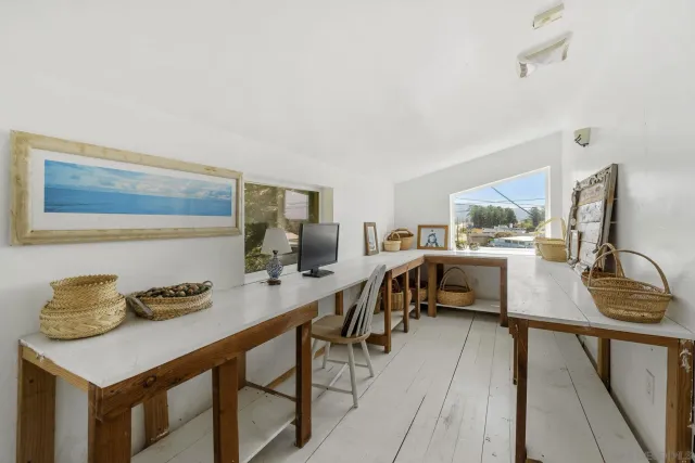 a view of a workspace with furniture and a couch
