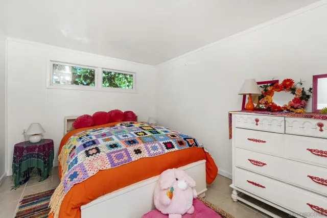 a bedroom with a bed and cabinets