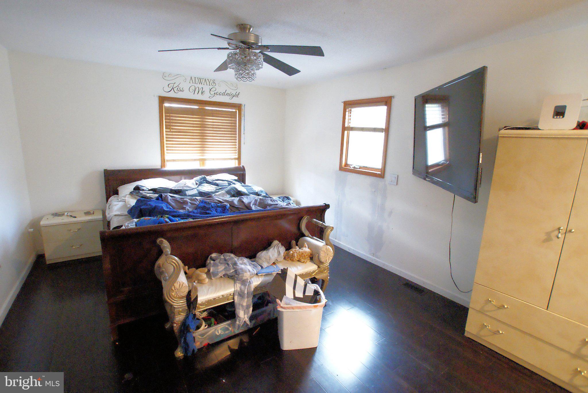 387 Frog Pond Road Little Egg Harbor, NJ 08087 - Photo 14 of 23 a bedroom with a bed and wooden floor