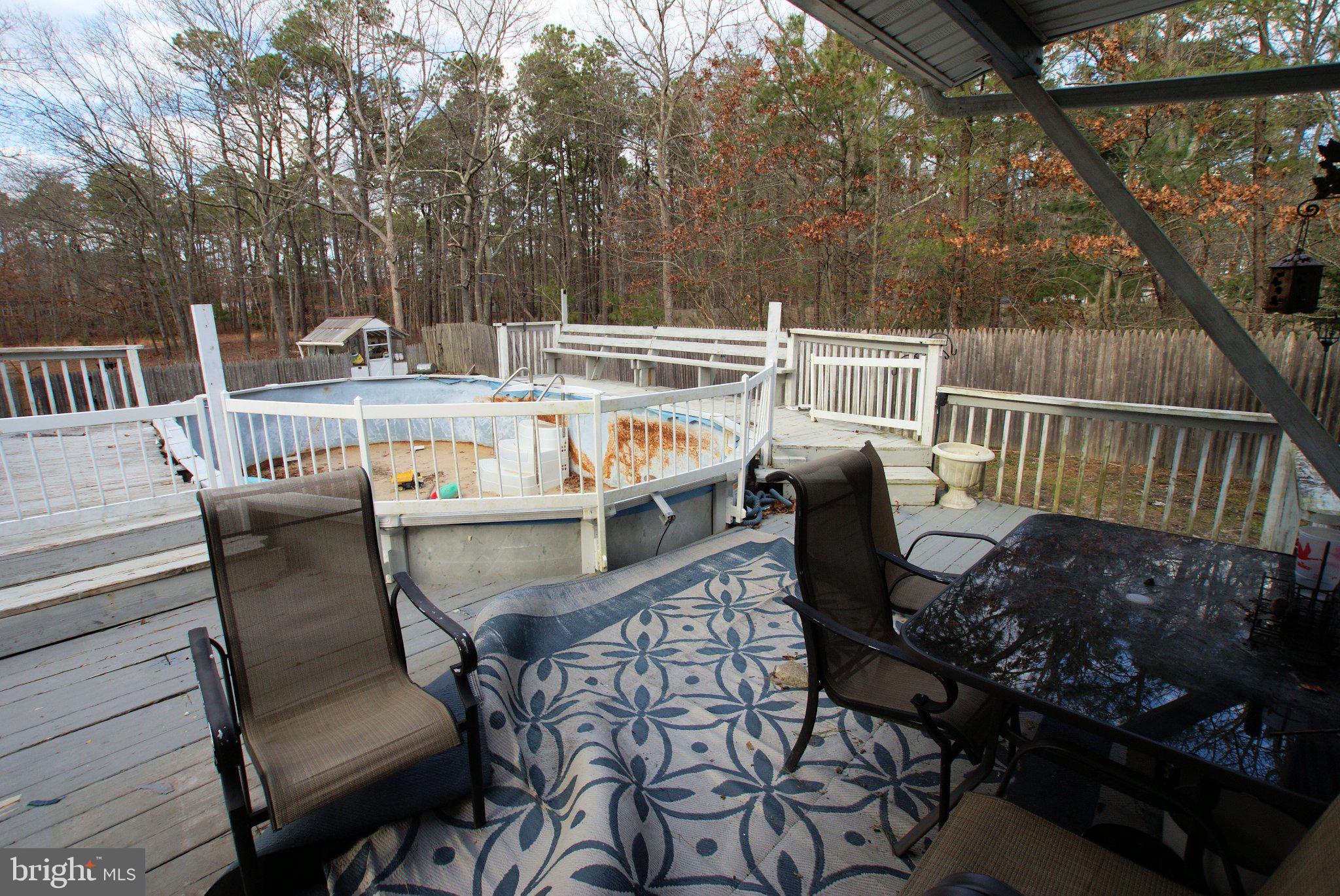 387 Frog Pond Road Little Egg Harbor, NJ 08087 - Photo 17 of 23 a view of a chairs and table in the patio