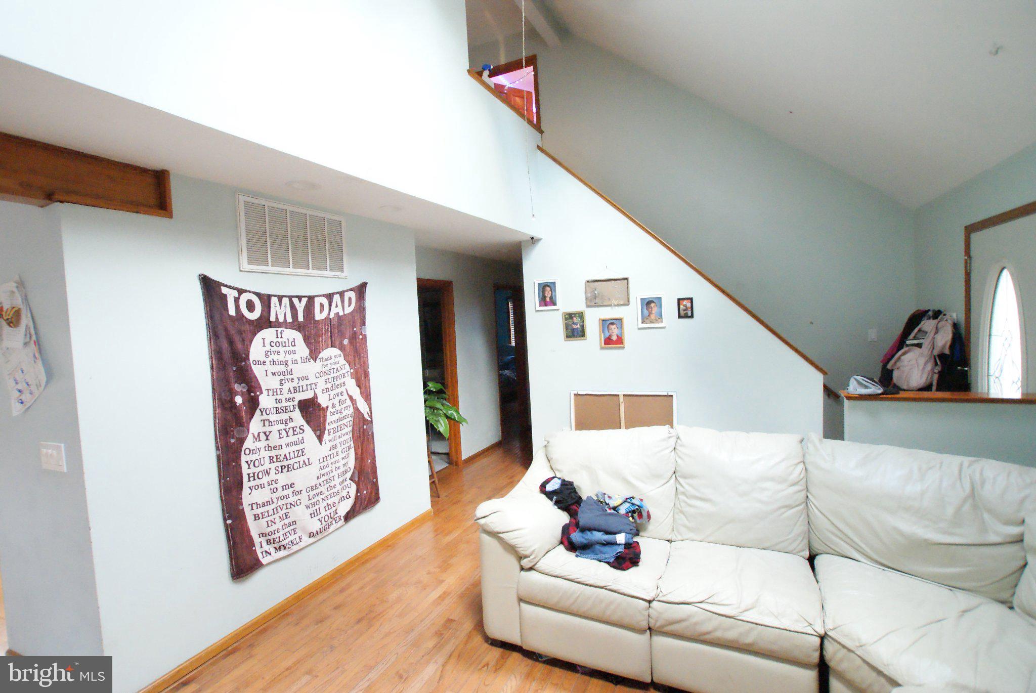 387 Frog Pond Road Little Egg Harbor, NJ 08087 - Photo 4 of 23 a living room with furniture and wall paintings