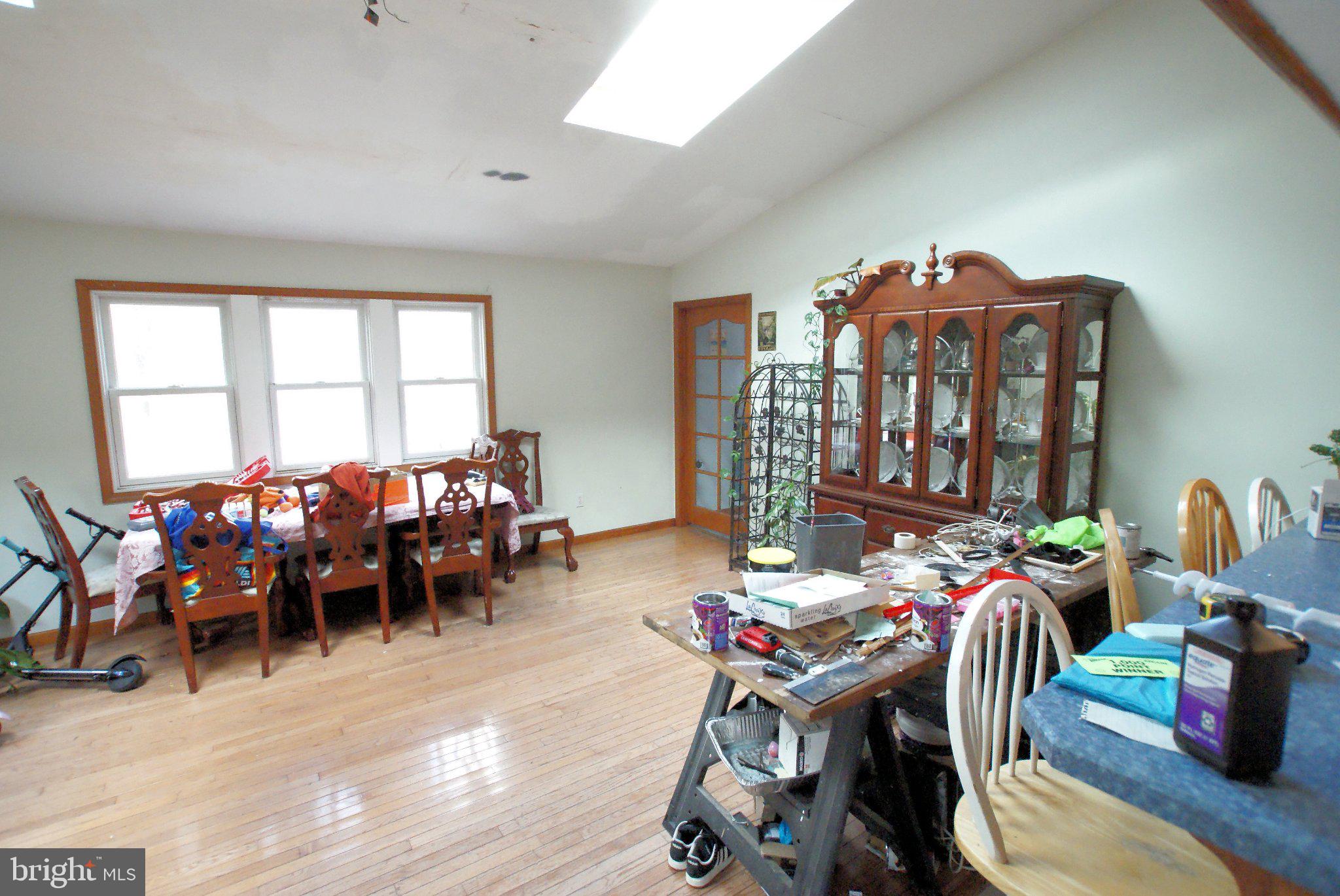 387 Frog Pond Road Little Egg Harbor, NJ 08087 - Photo 8 of 23 a living room filled with furniture a couch and a floor to ceiling window