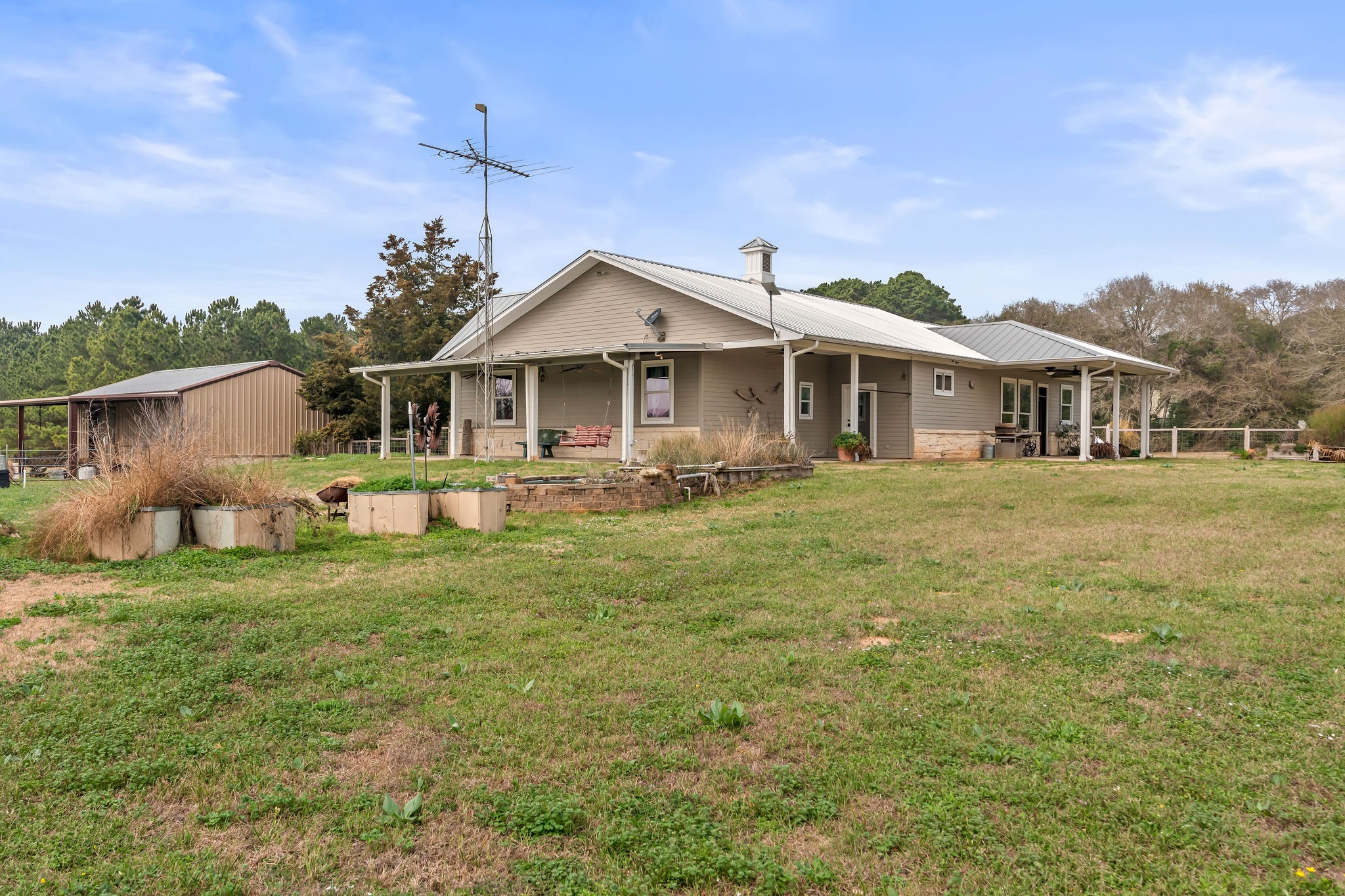 28322 Mellman Road Hempstead, TX 77445 - Photo 33 of 50 Porches are on three sides of the home.