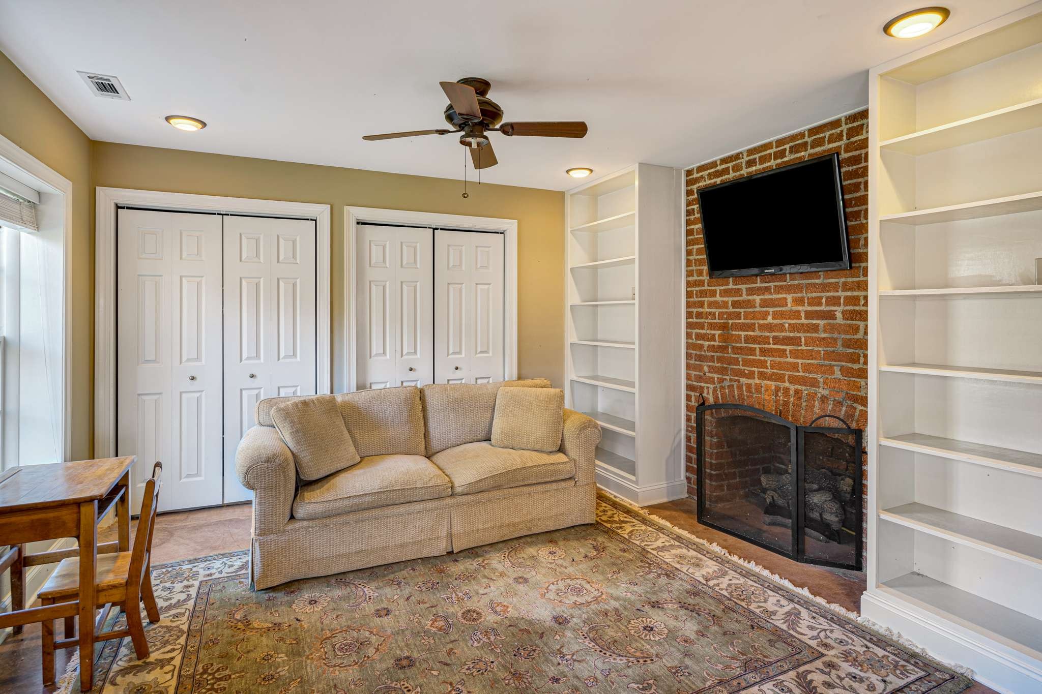 3002 Overlook Drive Nashville, TN 37212 - Photo 37 of 46 a living room with furniture and a flat screen tv