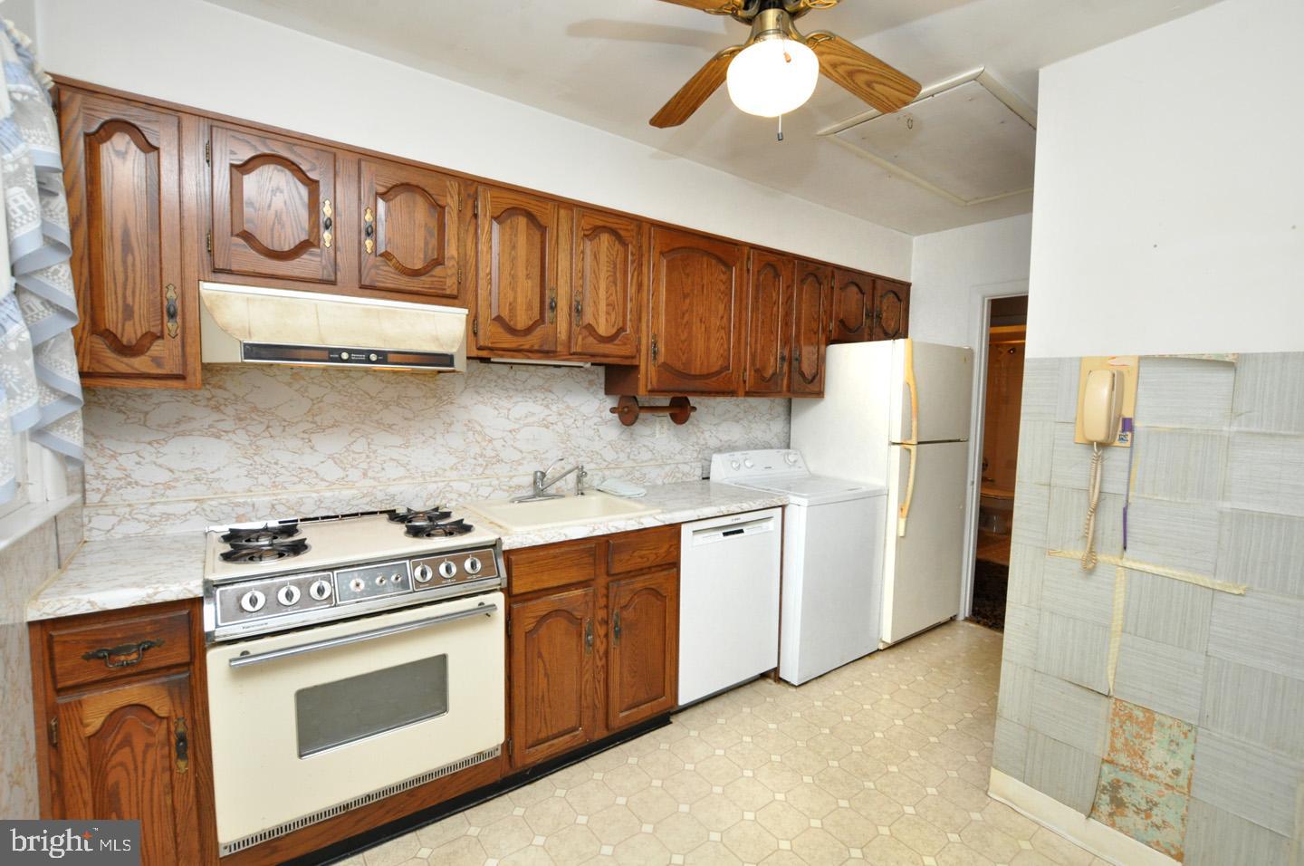 19 Rose Avenue Maple Shade, NJ 08052 - Photo 5 of 19 a kitchen with stainless steel appliances a stove a refrigerator and cabinets