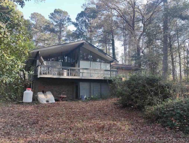 6245 Cliffdale Road Fayetteville, NC 28314 - Photo 3 of 11 a view of a house with a yard and large tree