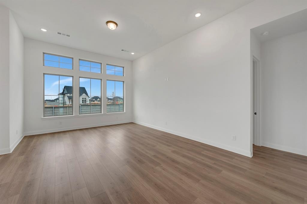 8712 Chestnut Lane Justin, TX 76247 - Photo 13 of 29 Unfurnished room featuring recessed lighting and dark wood finished floors