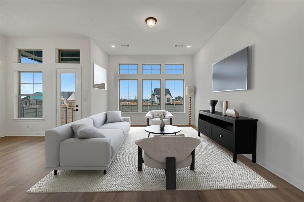 8712 Chestnut Lane Justin, TX 76247 - Photo 14 of 29 Living room with wood finished floors and recessed lighting