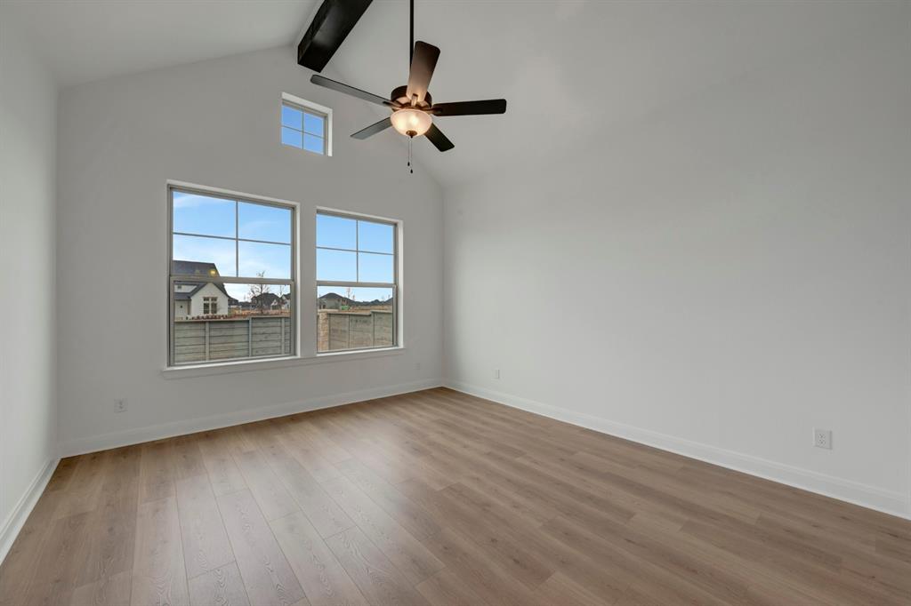 8712 Chestnut Lane Justin, TX 76247 - Photo 18 of 29 Unfurnished room with wood finished floors and ceiling fan