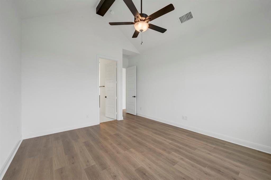 8712 Chestnut Lane Justin, TX 76247 - Photo 20 of 29 Unfurnished bedroom with dark wood-type flooring and ceiling fan