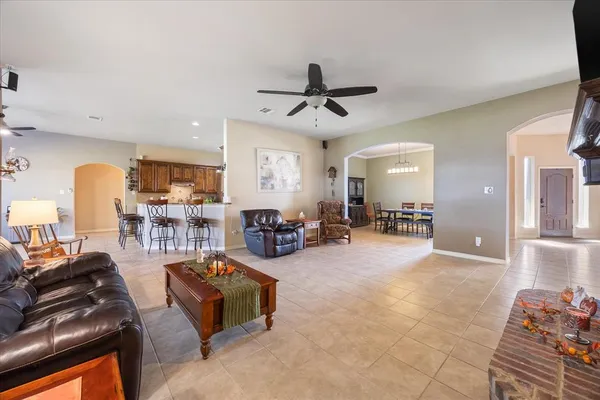 a view of a livingroom with furniture and a flat screen tv