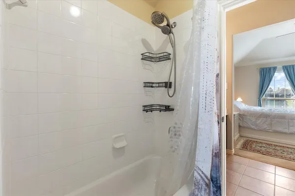a bathroom with a bathtub and shower