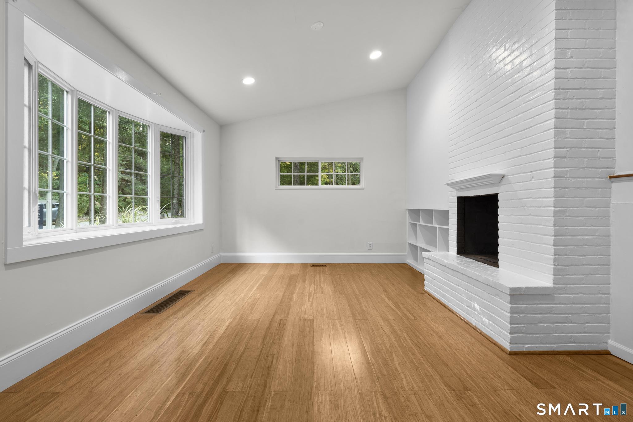 89 Book Hill Road Essex, CT 06426 - Photo 17 of 40 a view of a room with wooden floor and window