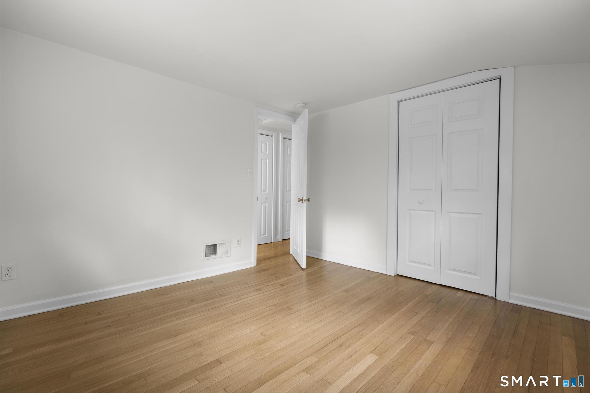 89 Book Hill Road Essex, CT 06426 - Photo 21 of 40 a view of an empty room with wooden floor