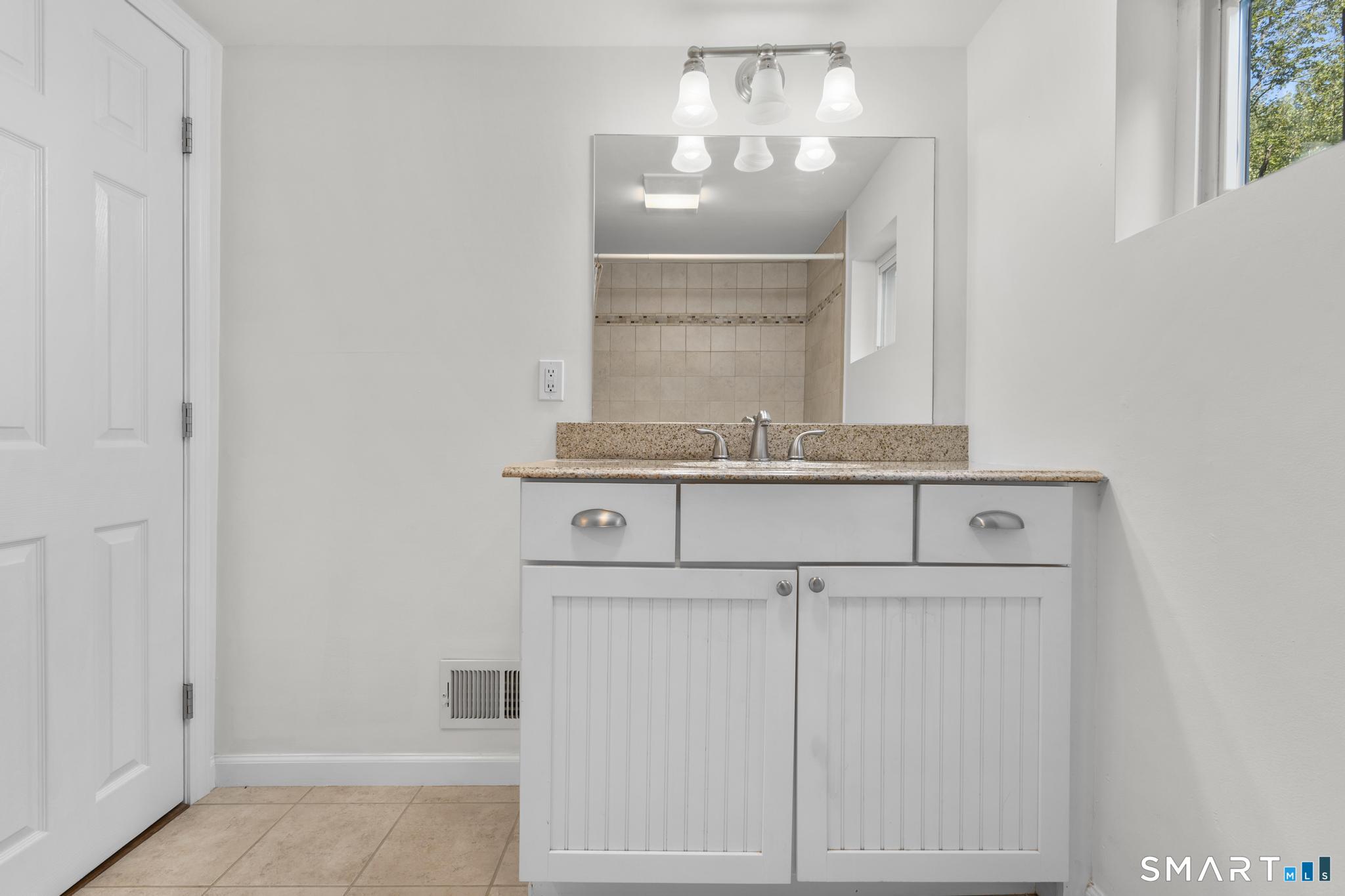 89 Book Hill Road Essex, CT 06426 - Photo 23 of 40 a close view of a sink and cabinets