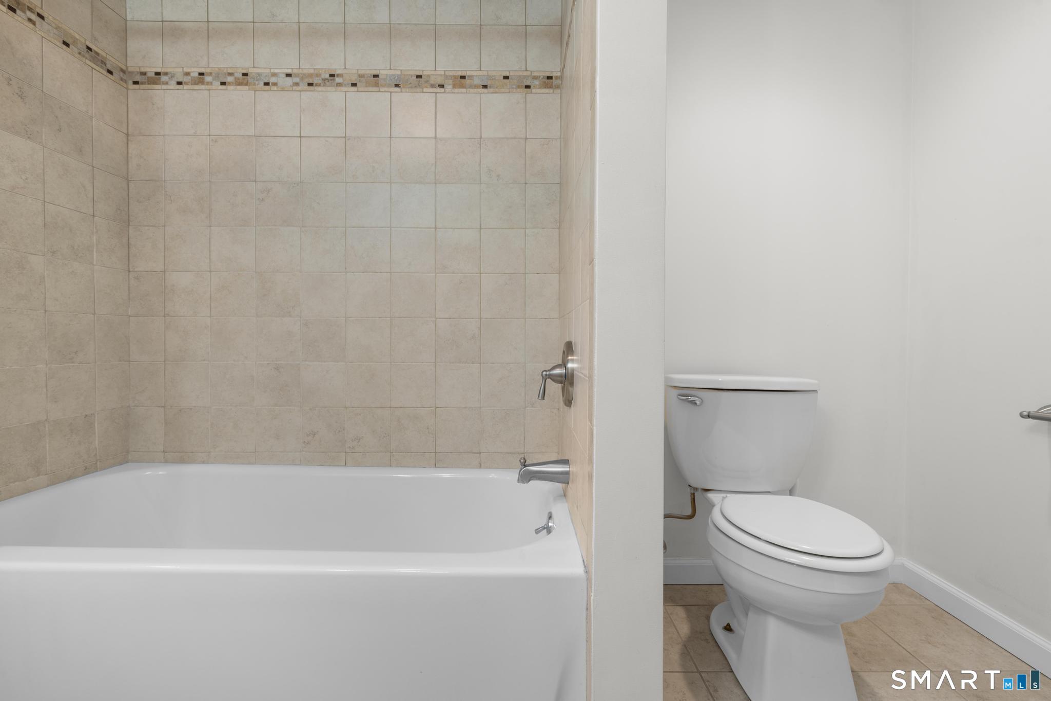 89 Book Hill Road Essex, CT 06426 - Photo 25 of 40 a bathroom with a toilet and a bathtub