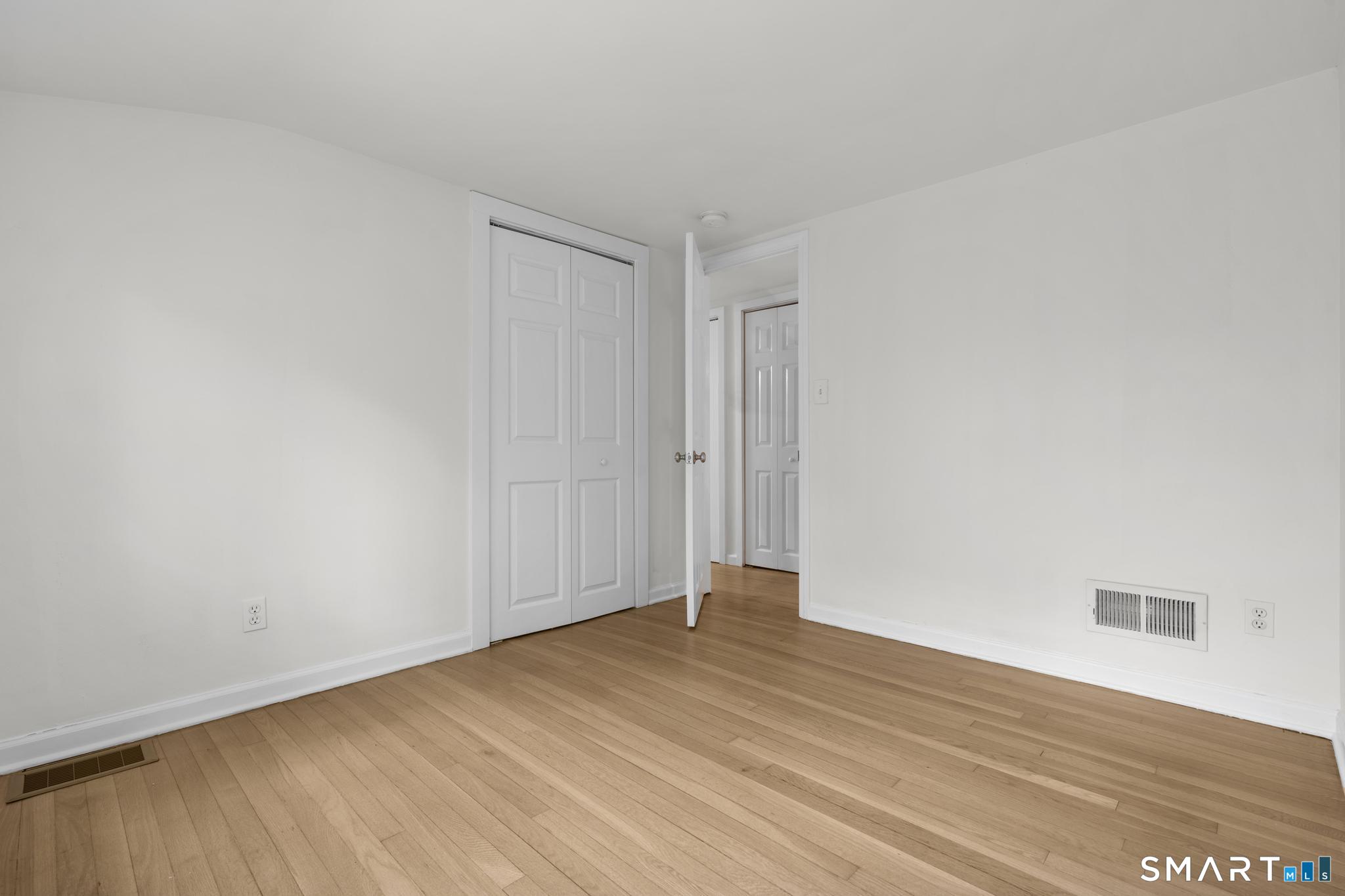 89 Book Hill Road Essex, CT 06426 - Photo 27 of 40 a view of an empty room with wooden floor