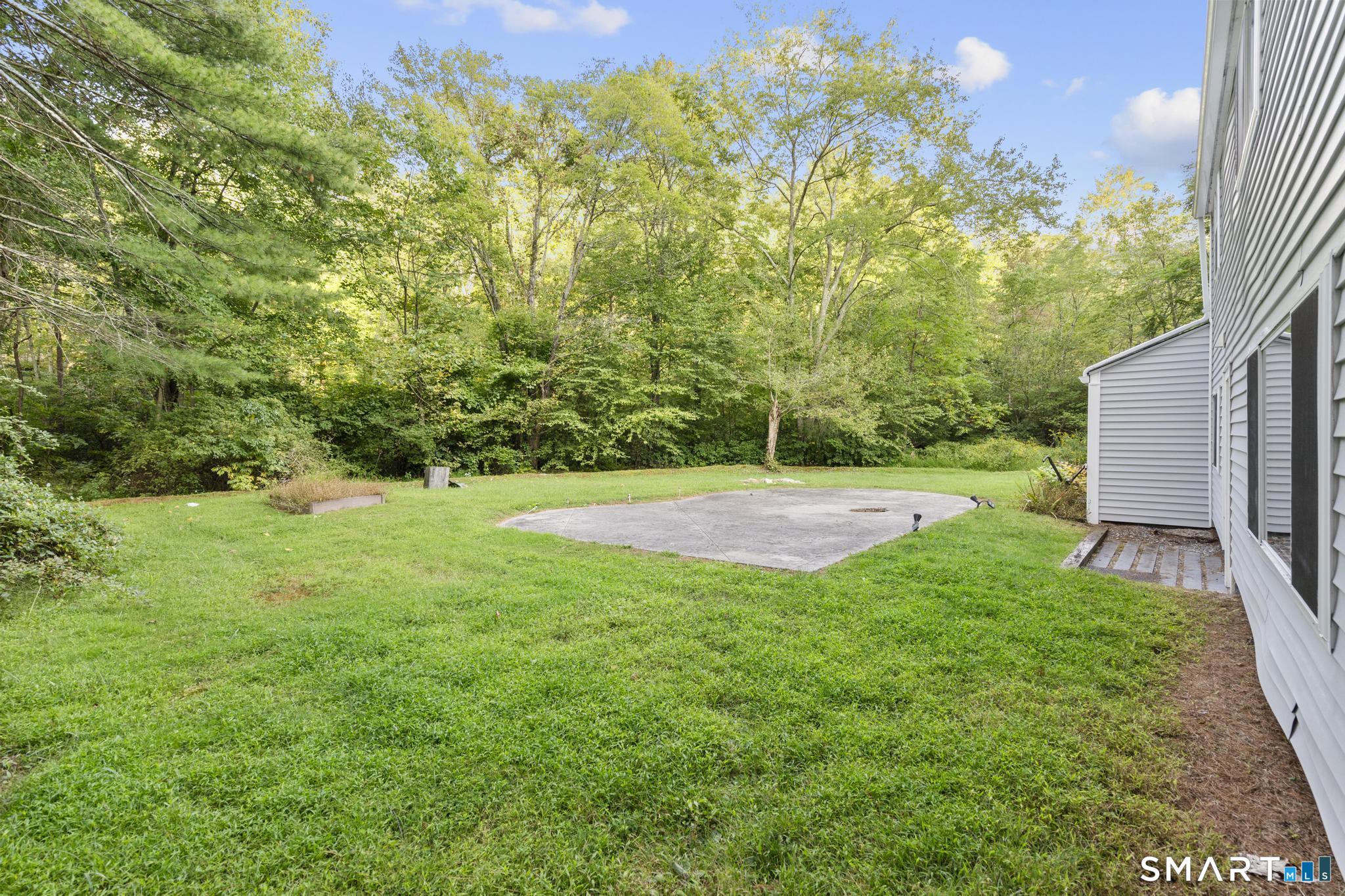 89 Book Hill Road Essex, CT 06426 - Photo 38 of 40 a view of a backyard with a garden