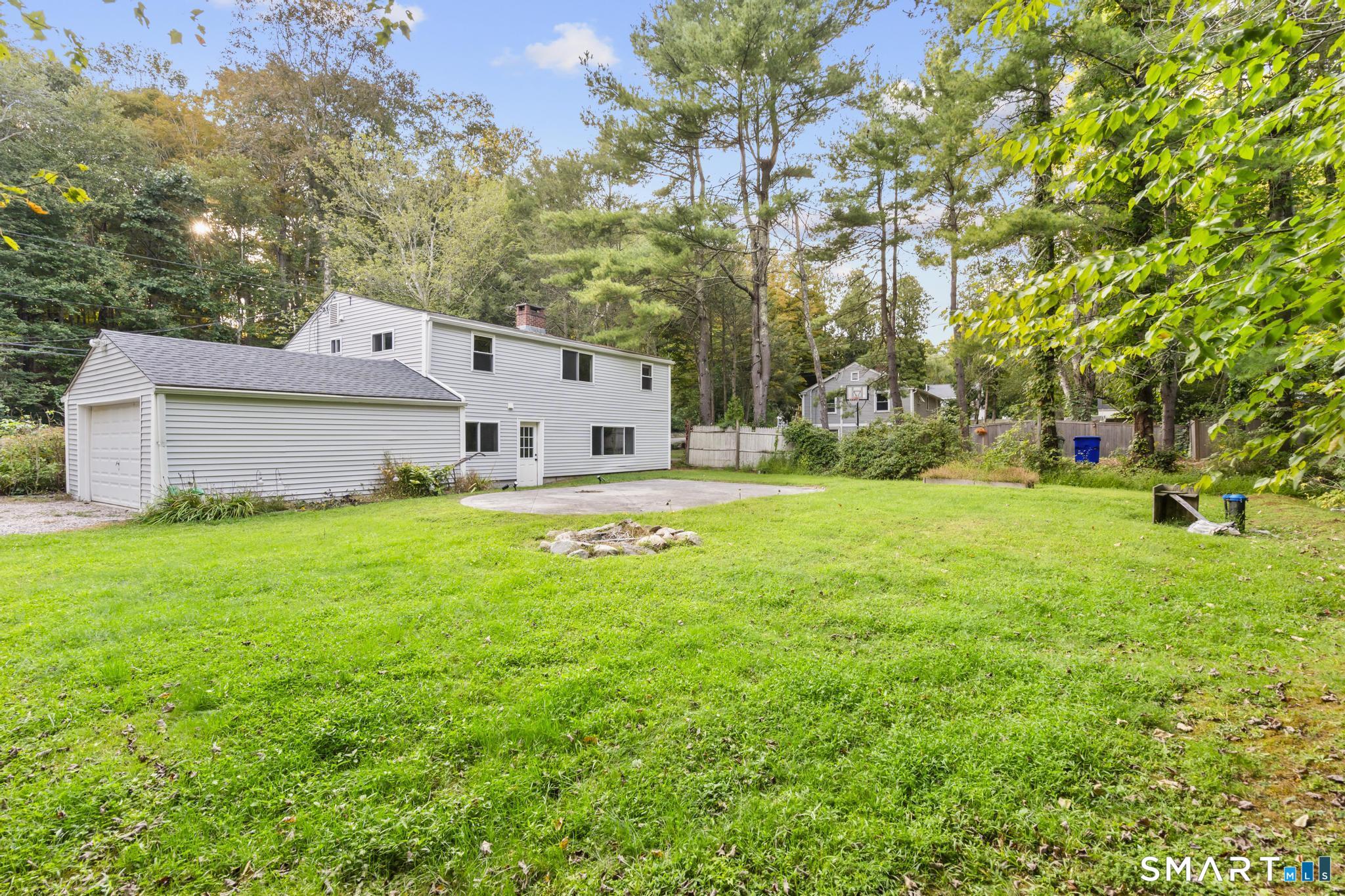 89 Book Hill Road Essex, CT 06426 - Photo 40 of 40 a view of a white house with a big yard and large tree
