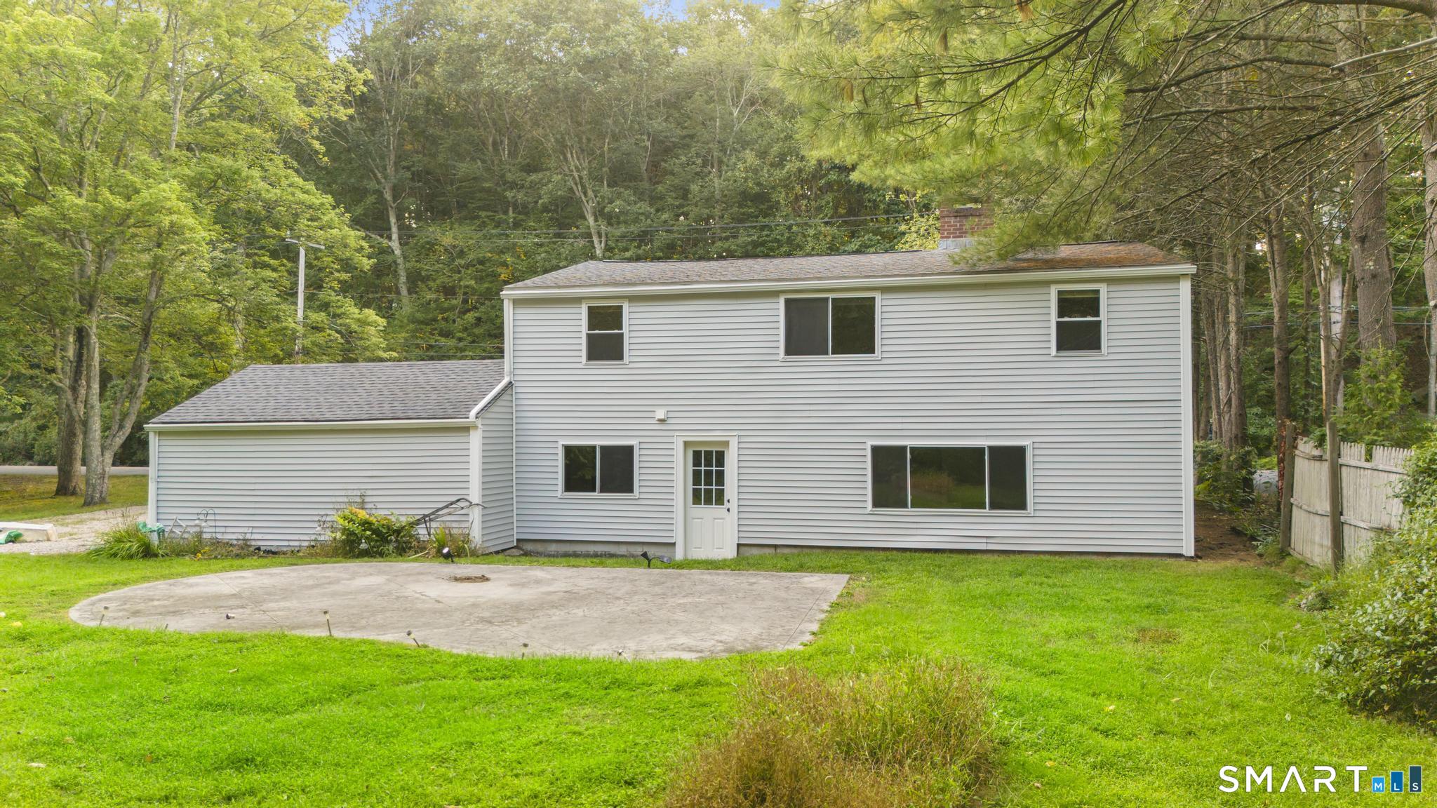 89 Book Hill Road Essex, CT 06426 - Photo 5 of 40 a view of a yard in front of a house with large tree