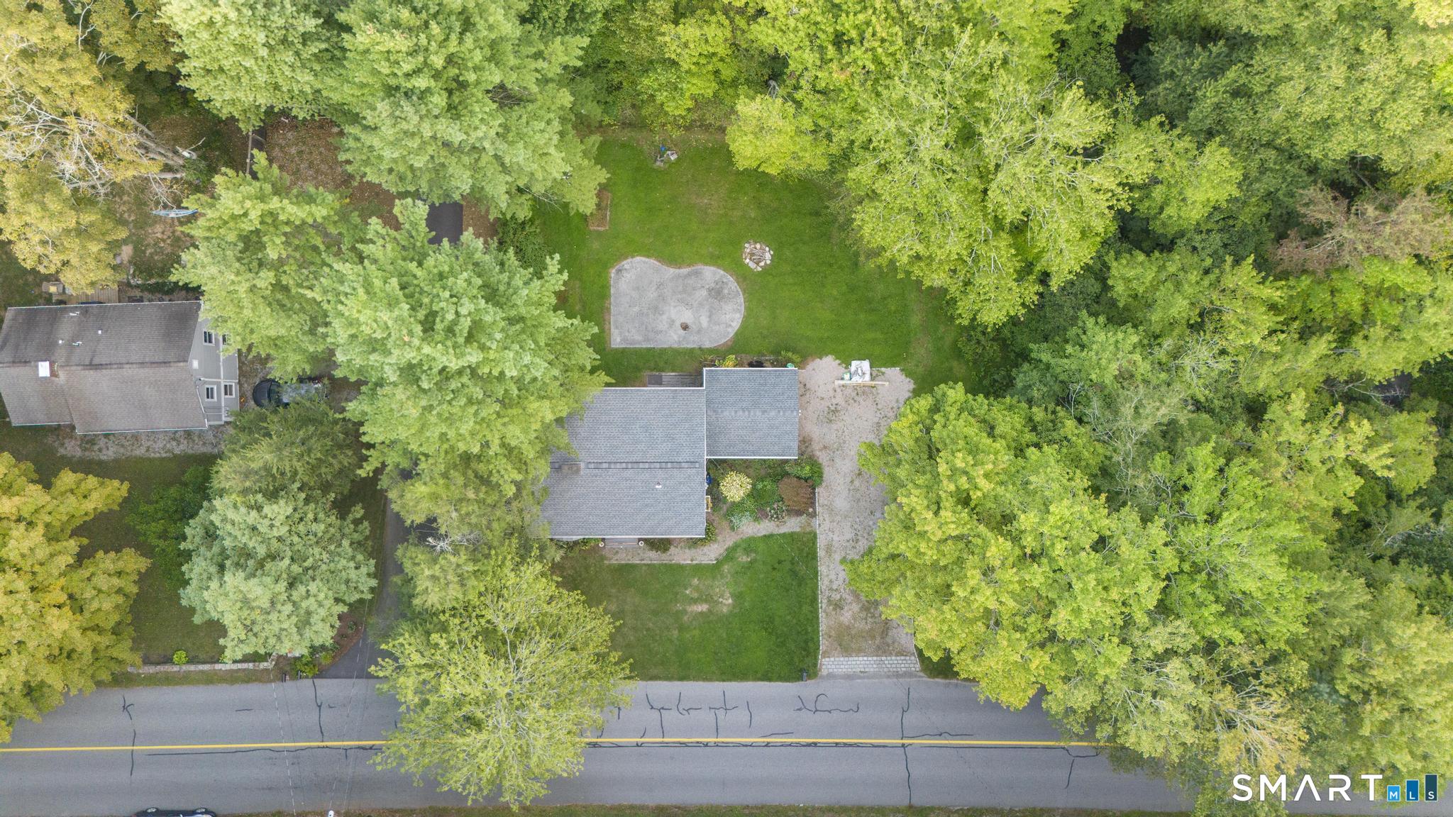 89 Book Hill Road Essex, CT 06426 - Photo 9 of 40 an aerial view of a house with a yard basket ball court and outdoor seating