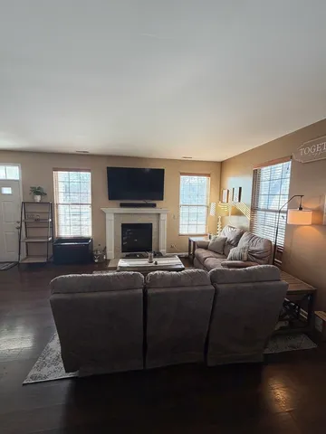 a view of entryway with wooden floor