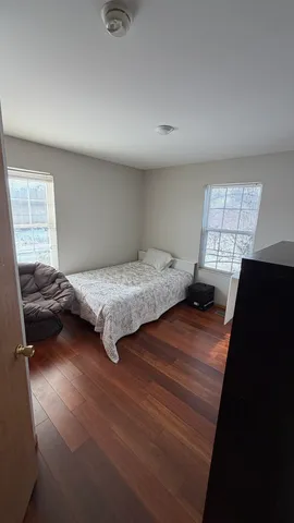 a bathroom with a double vanity sink and mirror