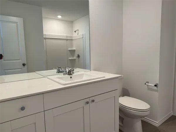 a bathroom with a sink toilet and vanity