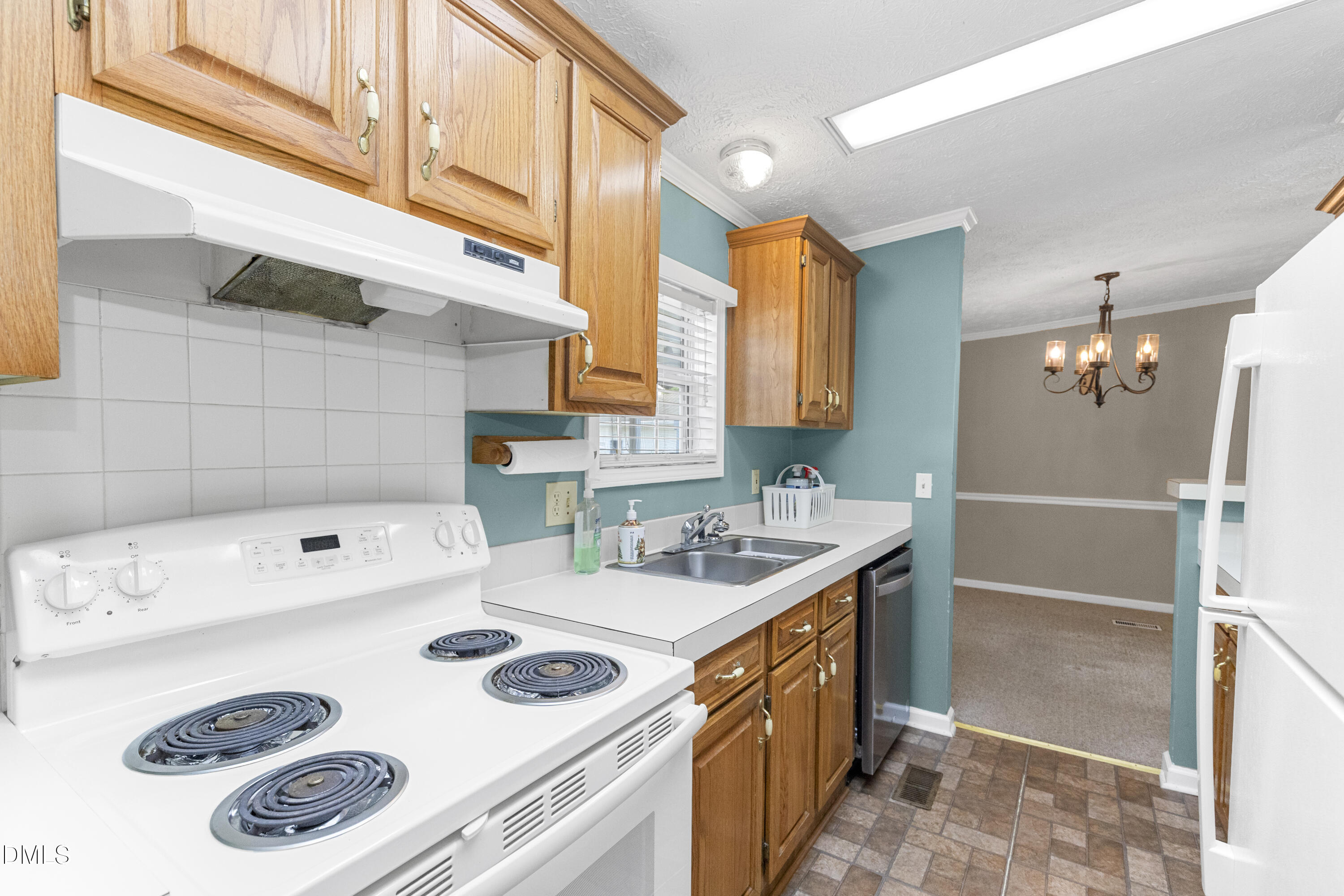 199 Iris Bryant Road Erwin, NC 28339 - Photo 7 of 33 a kitchen with a sink a stove and cabinets