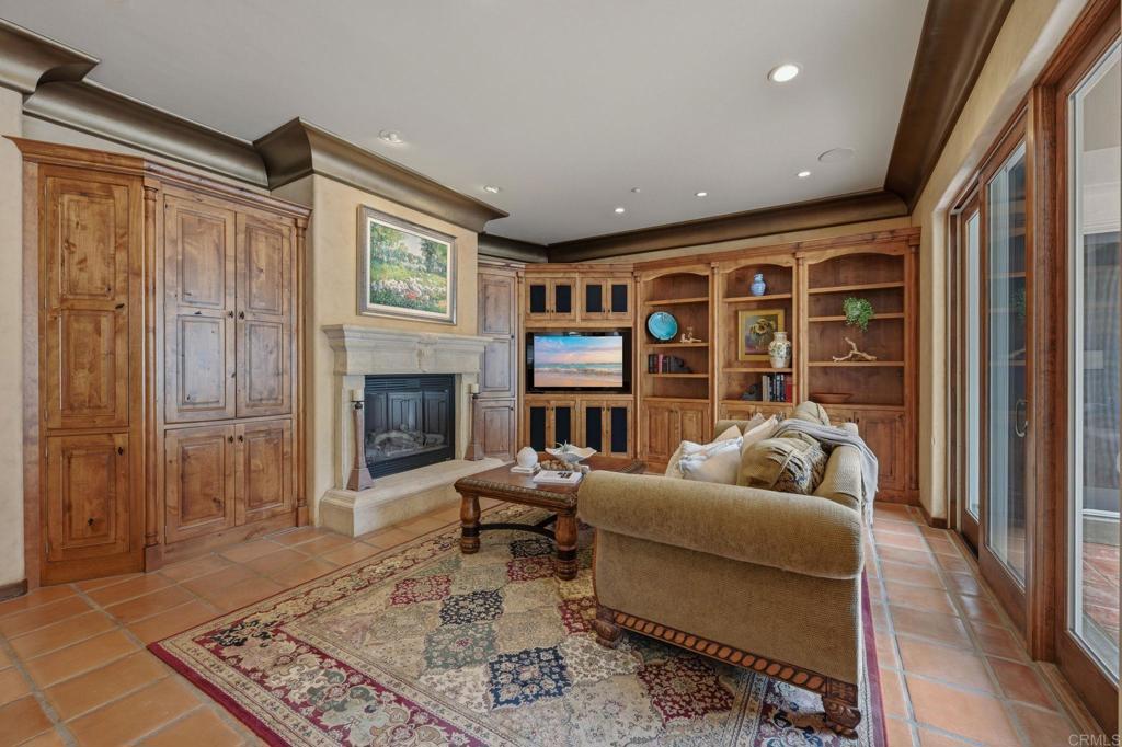 3244 Olivenhain Farms Road Encinitas, CA 92024 - Photo 15 of 47 a living room with furniture fireplace and a table