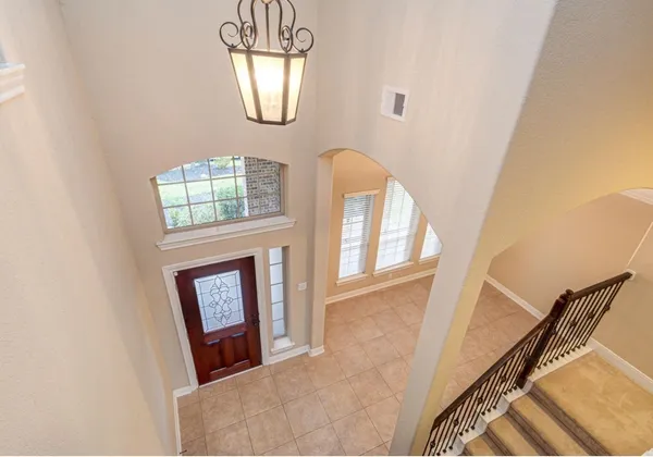a view of an entryway with wooden floor