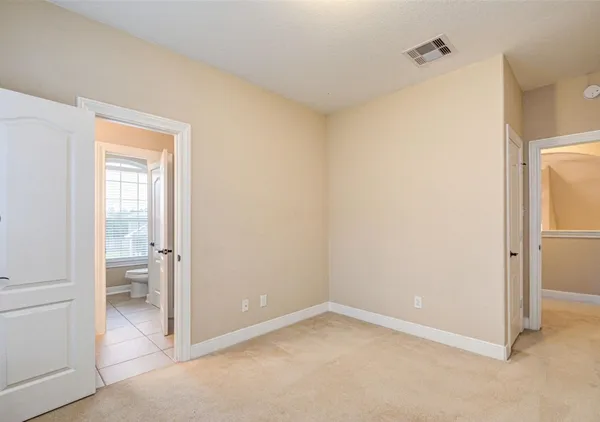 a view of room with tub and windows