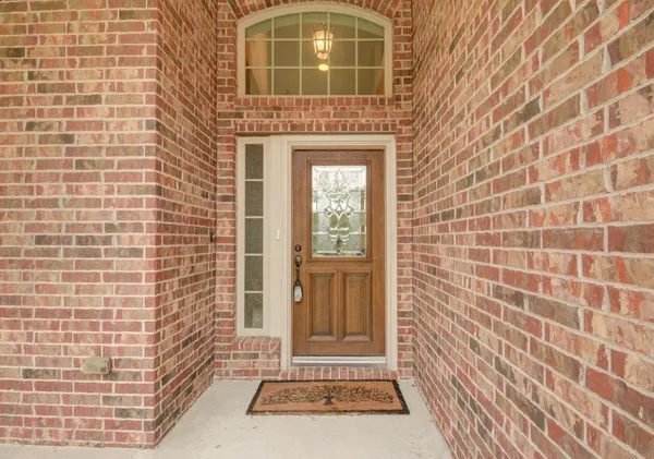 a view of a brick house with a door