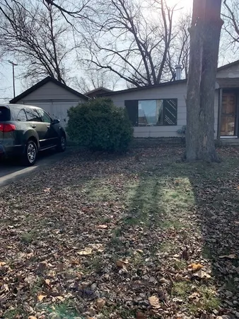 a view of a house with a back yard