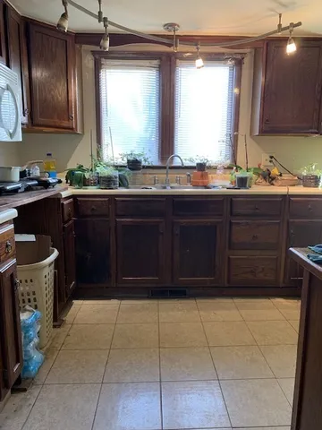 a kitchen with a cabinets and window