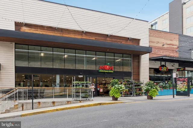 a view of a food market with retail stalls