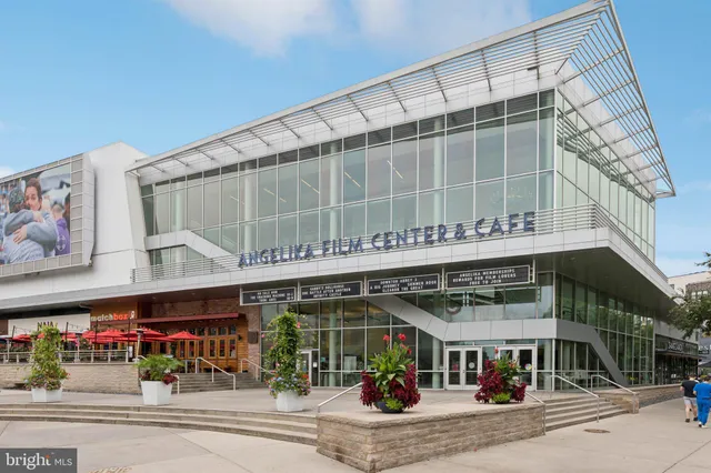 a front view of a building with parking