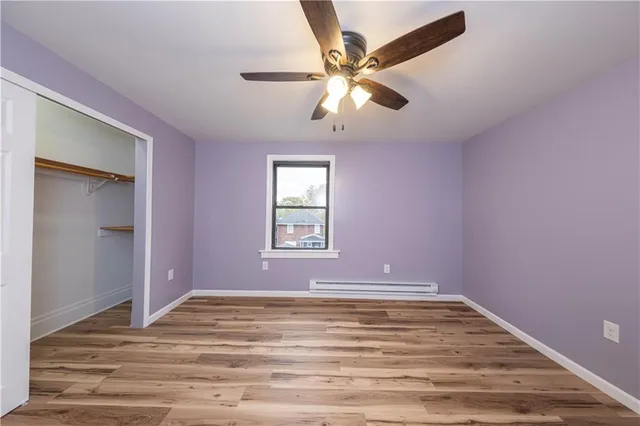 a view of room with window and ceiling fan