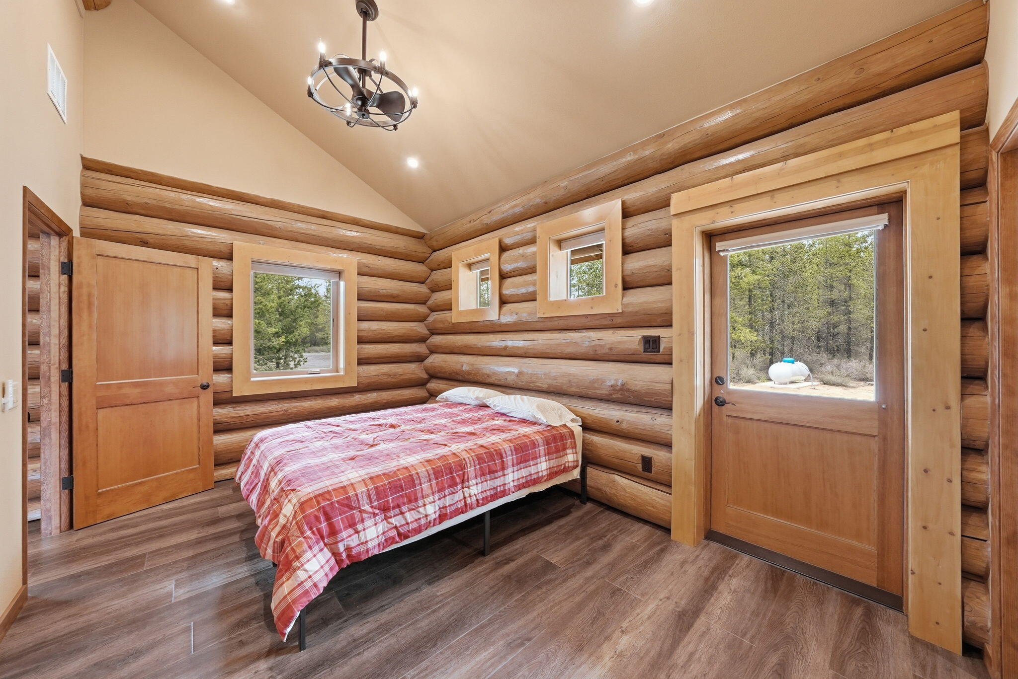 54270 Huntington Road La Pine, OR 97739 - Photo 14 of 68 a bedroom with a large bed and a window
