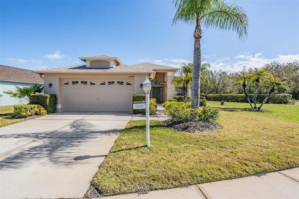 1606 Arbor Knoll Loop Trinity, FL 34655 - Photo 1 of 1 a view of a house with a yard and garage