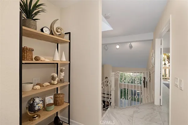 a bedroom with a bed and a night stand
