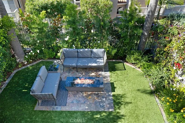 a view of a backyard with sitting area