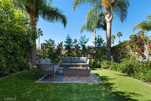 a view of a backyard with sitting area