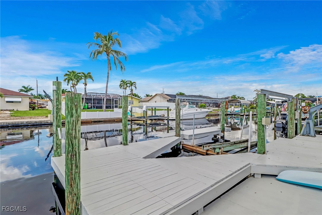 4838 Tudor Drive Cape Coral, FL 33904 - Photo 16 of 20 a view of a terrace with furniture