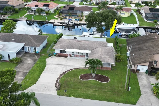 an aerial view of a house with outdoor space