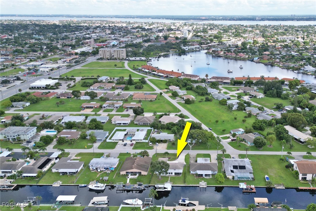 4838 Tudor Drive Cape Coral, FL 33904 - Photo 19 of 20 an aerial view of residential building and lake