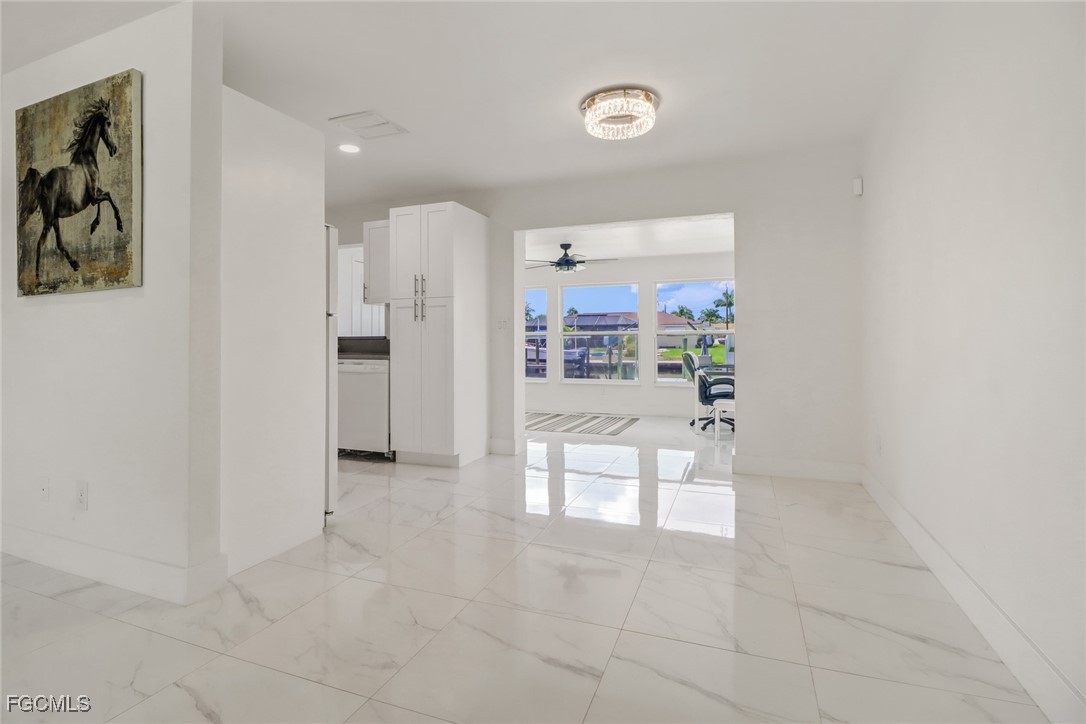4838 Tudor Drive Cape Coral, FL 33904 - Photo 8 of 20 a view of kitchen and windows