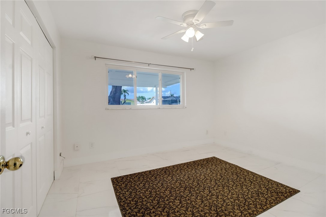 4838 Tudor Drive Cape Coral, FL 33904 - Photo 9 of 20 a view of an empty room with a window