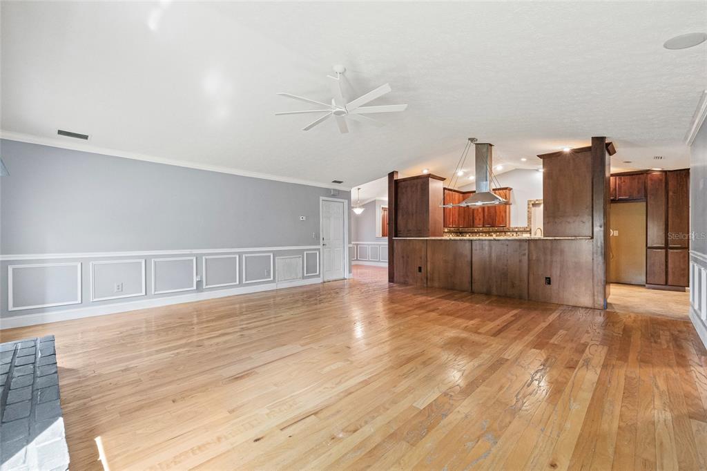 603 Cottage Grove Circle Valrico, FL 33594 - Photo 25 of 60 a view of a kitchen with wooden floor and a kitchen