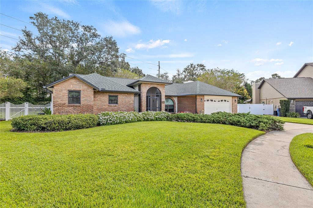 603 Cottage Grove Circle Valrico, FL 33594 - Photo 4 of 60 a front view of house with yard and green space